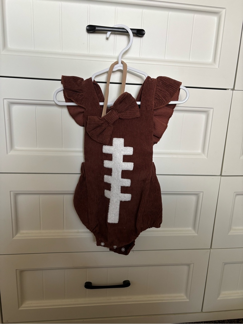 Kids Brown Ruffle One-Piece with White Football Stitch Detail